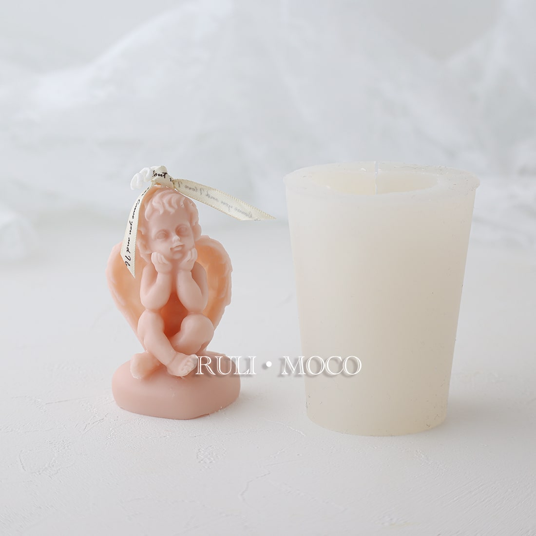 Angel on a heart pedestal